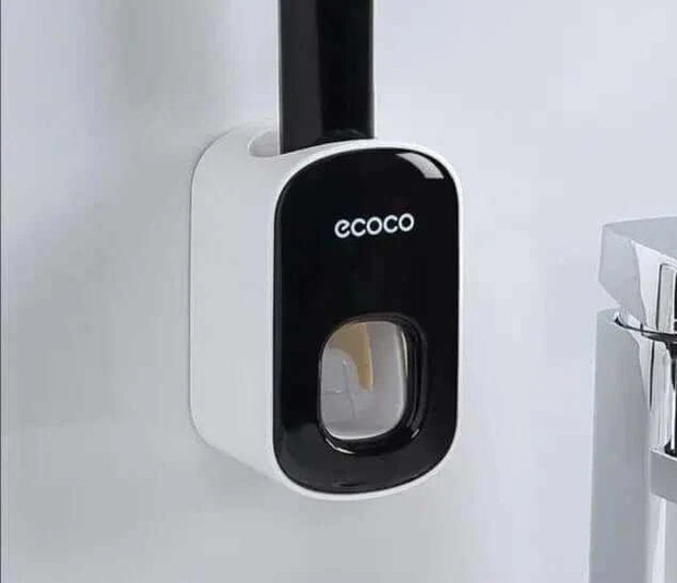 Automatic Toothpaste Dispenser wall-mounted design in a bathroom.