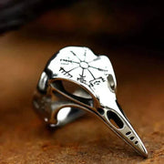 Silver Gothic ring with intricate skull design and black enamel finish.
