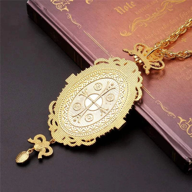 Orthodox Jesus Cross Pendant with intricate design and high-quality craftsmanship on religious book.