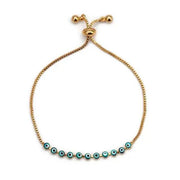 Elegant charm bracelet with turquoise evil eye beads on a gold chain, perfect for self-expression.