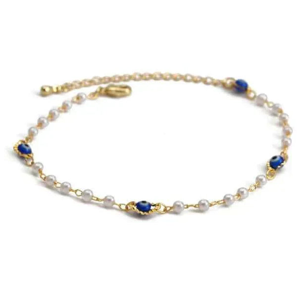 Delicate charm bracelet with blue and white beads, gold accents, and a secure clasp.