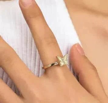 Fidget Spinner Ring with butterfly design worn on finger, stylish and functional accessory for stress relief.