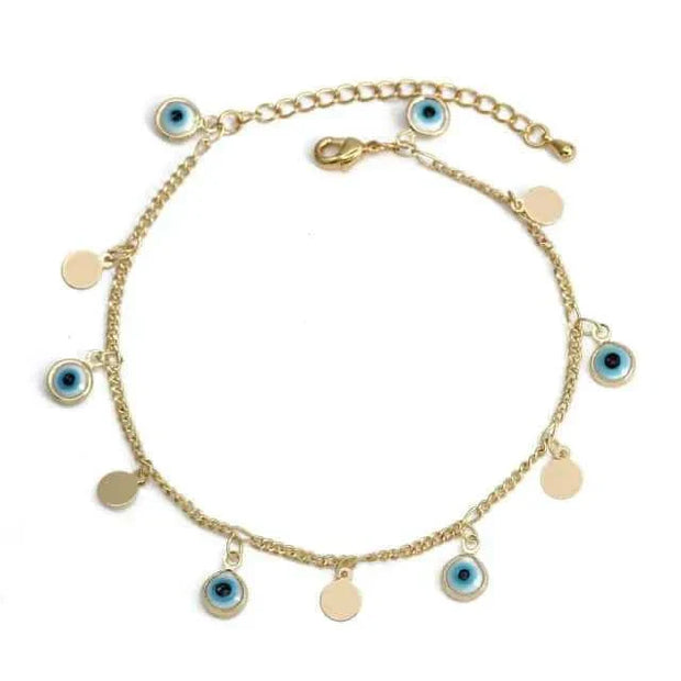 Elegant charm bracelet with gold chain and eye charm accents.