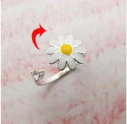 Fidget Spinner Ring with daisy design and built-in spinning mechanism.