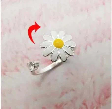Fidget Spinner Ring with daisy design and built-in spinning mechanism.