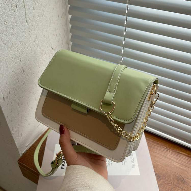 Square Chain Shoulder Bag with gold chain strap in green and beige, contemporary design for day and evening wear.