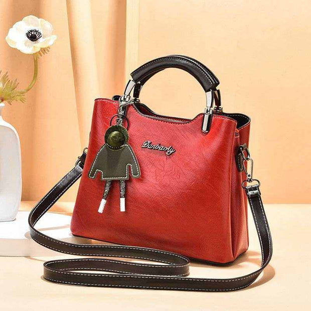 Small Retro Handbag in wine red with top handle and shoulder strap, vintage charm and durable PU material.
