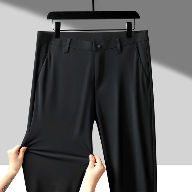 Anti-Wrinkle Business Trousers in black displayed on a hanger, showcasing their sleek design and wrinkle-resistant fabric.