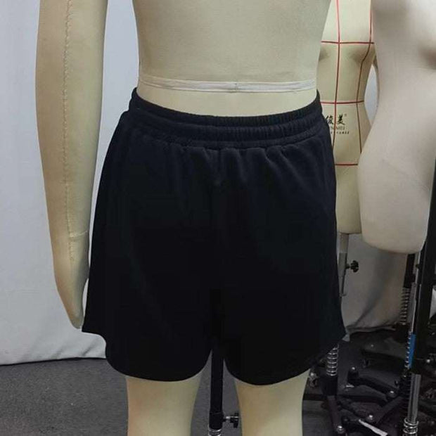 Black printed casual shorts on mannequin with elastic waistband, showcasing back view.