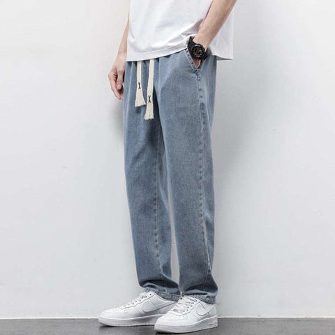 Washed Wide Leg Jeans in light blue denim, featuring a relaxed fit and high-rise waist for effortless style and comfort.