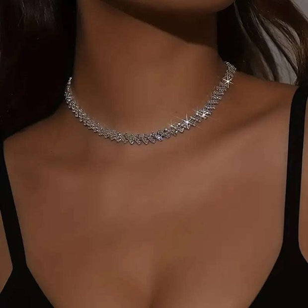 Fashion Love Necklace with silver heart pendant on woman's neck.