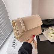 Elegant Square Chain Shoulder Bag with gold chain strap and sleek design.