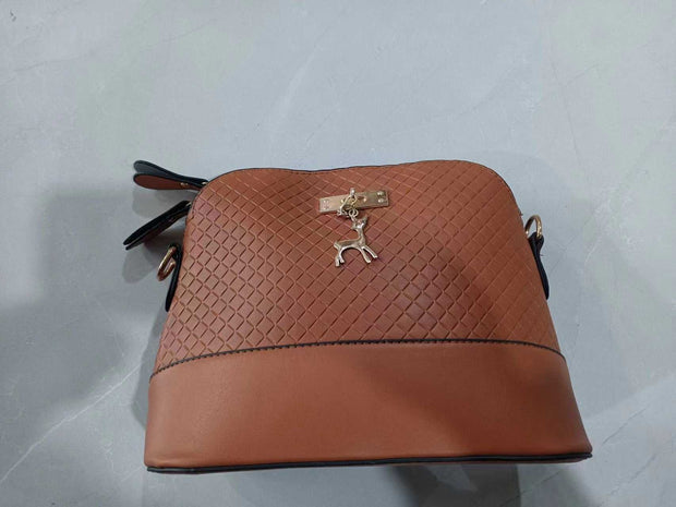 Womens Mini Portable Handbag in brown PU with woven texture design.