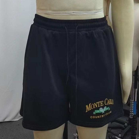Black printed casual shorts with elastic waistband and vibrant design, perfect for summer comfort and style.
