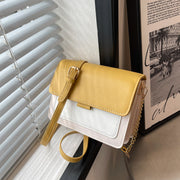 Square Chain Shoulder Bag with yellow and white design, featuring a stylish chain strap, displayed indoors.