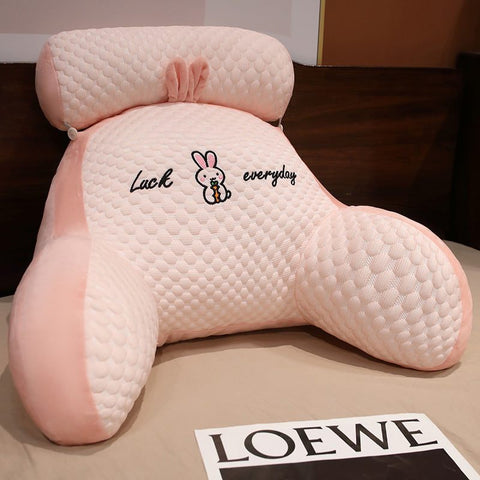 Fluffy Sofa Cushion Pillow with ergonomic design and cute bunny embroidery on a bed.