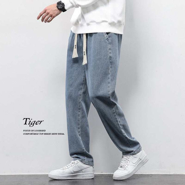 Washed Wide Leg Jeans in light blue, showcasing relaxed fit and vintage-inspired finish.