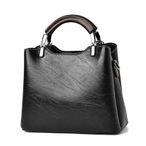 Black Small Retro Handbag with vintage design and top handle.
