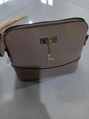 Womens Mini Portable Handbag with quilted design and deer charm, compact and stylish.