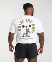 Mens short sleeve shirt with weightlifting design, featuring "Raise the Bar" text on the back.