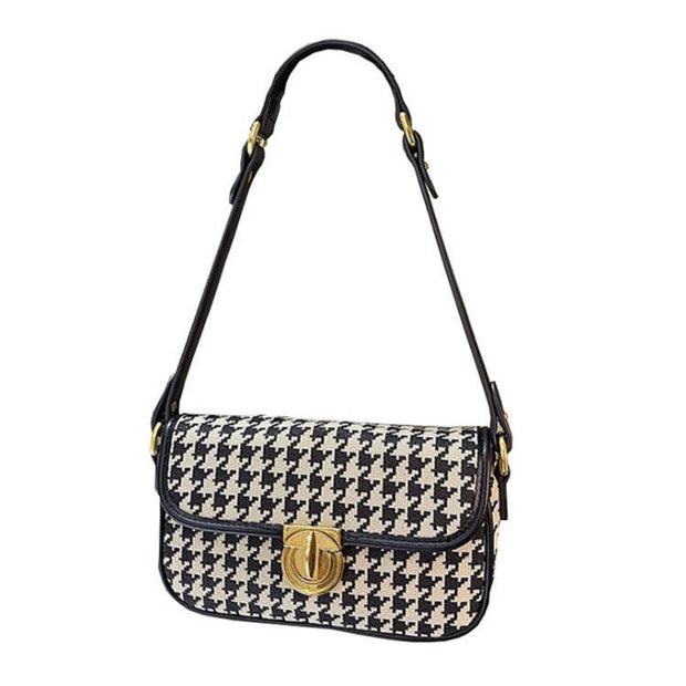 Houndstooth Baguette Bag with classic pattern and gold clasp.