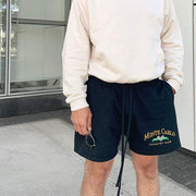 Black Printed Casual Shorts with elastic waistband, offering comfort and style for summer occasions.