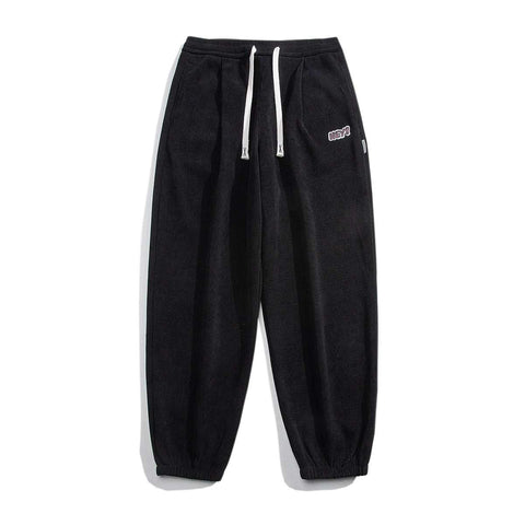 Black straight-leg sweatpants with drawstring waist for comfort and style.