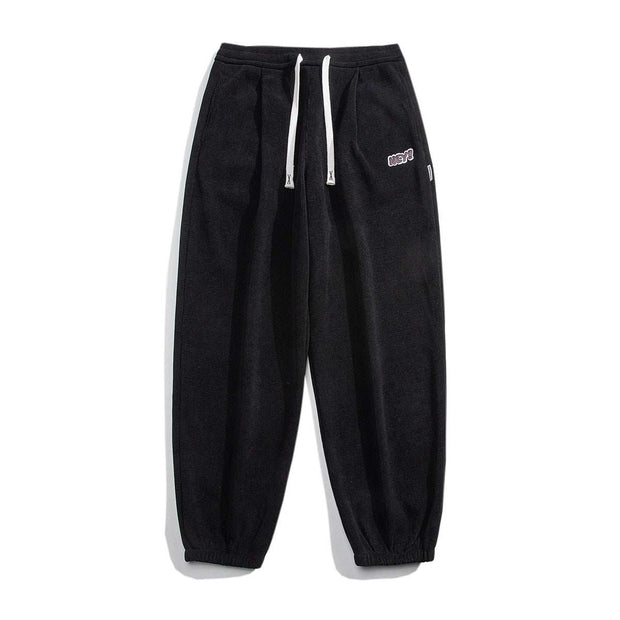 Black straight-leg sweatpants with drawstring waist for comfort and style.