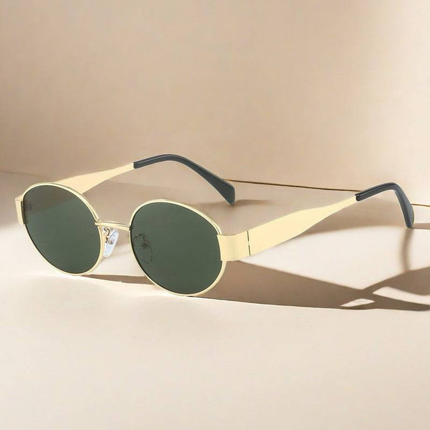 Vintage metal oval sunglasses with sleek frame and tinted lenses, featuring a blend of elegance and retro charm, designed for women.