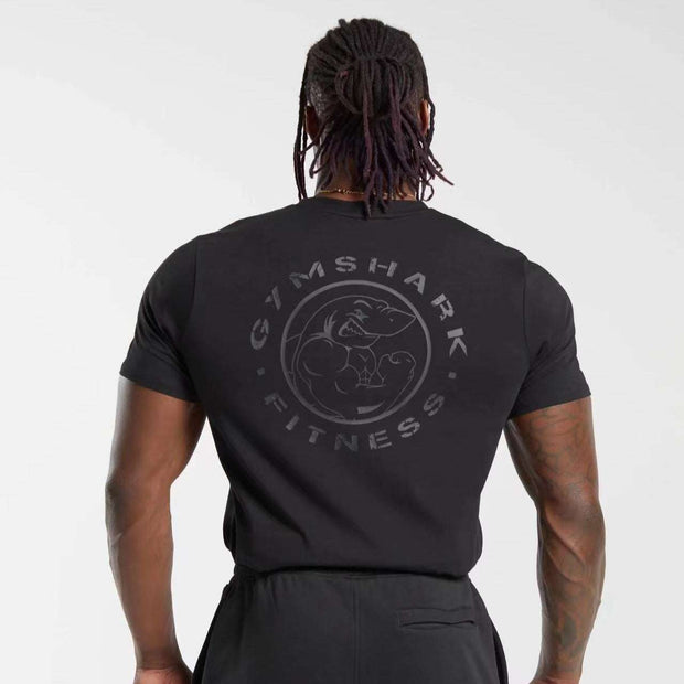 Mens short sleeve shirt in black with a Gymshark fitness logo, ideal for casual and sporty occasions.