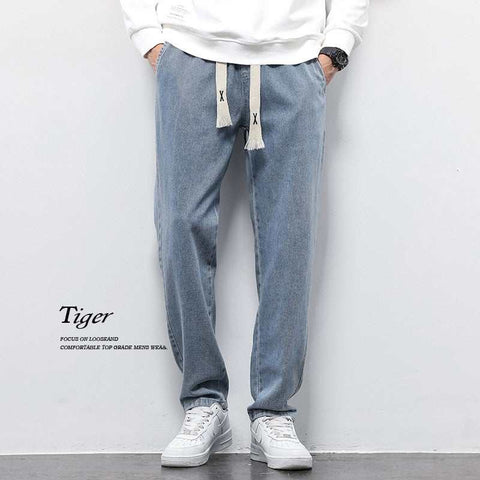 Wide leg jeans with vintage wash, high-quality denim, and relaxed fit.