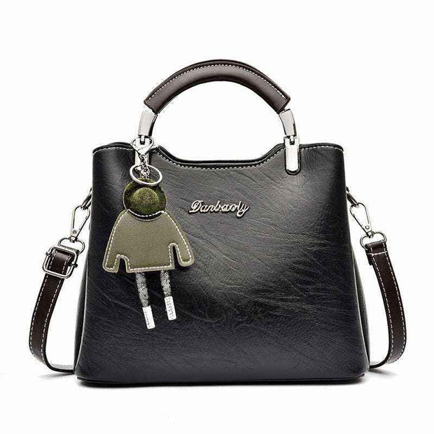 Small Retro Handbag with keychain, black PU leather, top handle, and shoulder strap.