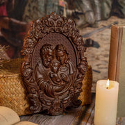 Religious Holy Family Wooden Icon depicting Jesus, Mary, and Joseph with intricate craftsmanship and natural wood finish, ideal for home or worship spaces.