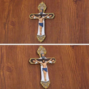 Religious Cross Wall Ornament with intricate design on wooden background.
