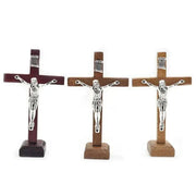 Wooden Jesus Cross with stand in three colors: brown, light brown, and wine red, featuring intricate detailing and a sturdy base.