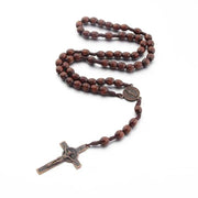 Hand-made Wooden Rosary Necklace with detailed cross pendant and polished wooden beads.