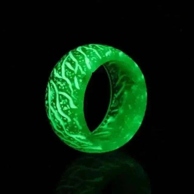 Luminous Love Glow Ring with enchanting glow effect in dark setting.