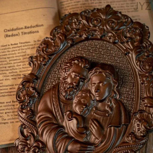 Religious Holy Family wooden icon with intricate carvings depicting Jesus, Mary, and Joseph.