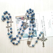Rosary Necklace with Cross Pendant featuring blue beads and intricate cross design, showcasing faith and spirituality.