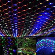 Colorful Net Mesh Solar Fairy Lights illuminating outdoors.