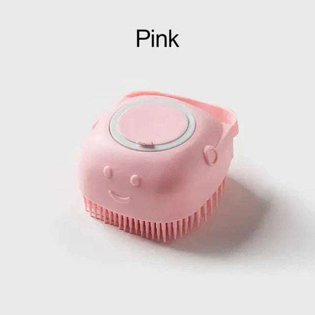 Pink soft silicone dog brush with built-in shampoo dispenser and comfort grip.