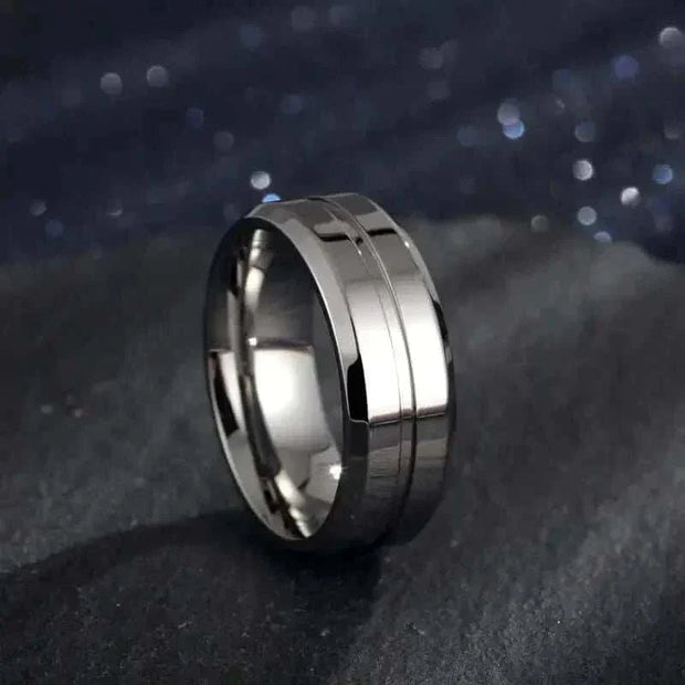 Gold Electroplated Ring with flawless finish and geometric design on dark background.