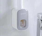 Automatic Toothpaste Dispenser mounted on bathroom wall for convenience and efficiency.