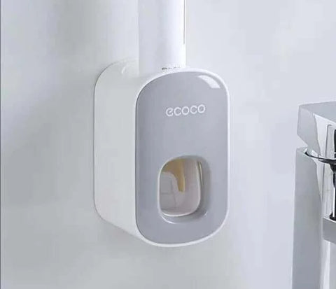 Automatic Toothpaste Dispenser mounted on bathroom wall for convenience and efficiency.