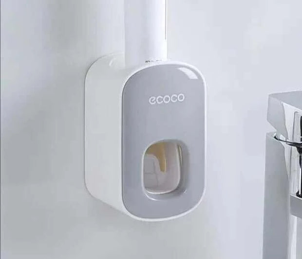 Automatic Toothpaste Dispenser mounted on bathroom wall for convenience and efficiency.