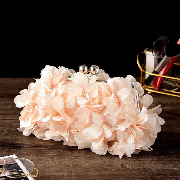 Elegant bridal clutch adorned with floral elements, perfect for weddings and special occasions.