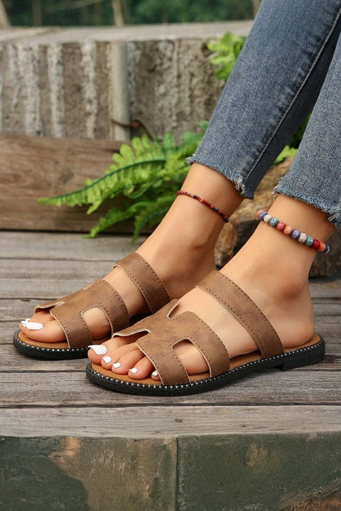 Black leather H band slides with cushioned footbed for comfort.