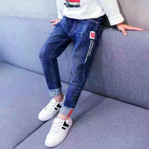 Boys denim jeans with adjustable waistband and stylish detailing.