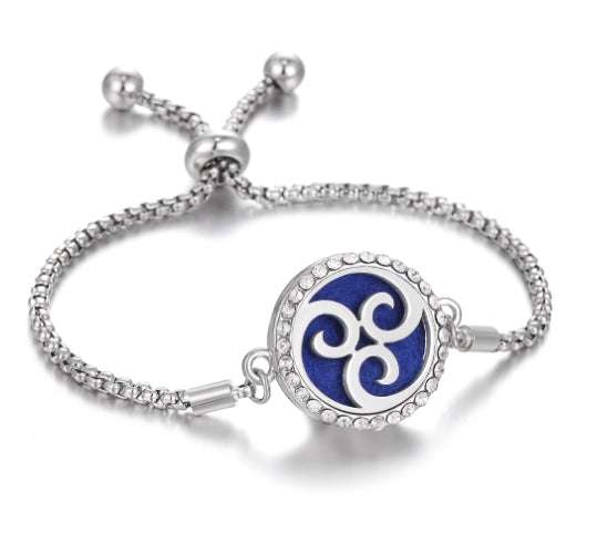 Hollow Stainless Steel Aromatherapy Bracelet with adjustable chain and intricate design.