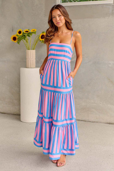 Green and pink striped smocked dress with spaghetti straps and tiered design.